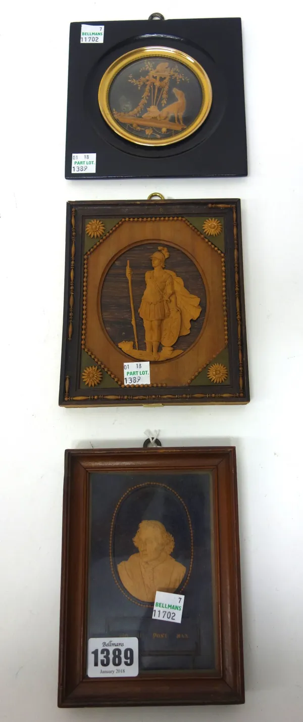An early 19th century miniature wooden relief carved plaque depicting a Roman soldier in a carved wood frame, 15cm x 13cm, and two further black fores
