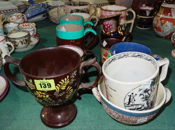 Ceramics, including; a group of early 19th century mugs and tankards, a loving mug with a country scene, another mug moulded with cricketers, a copper