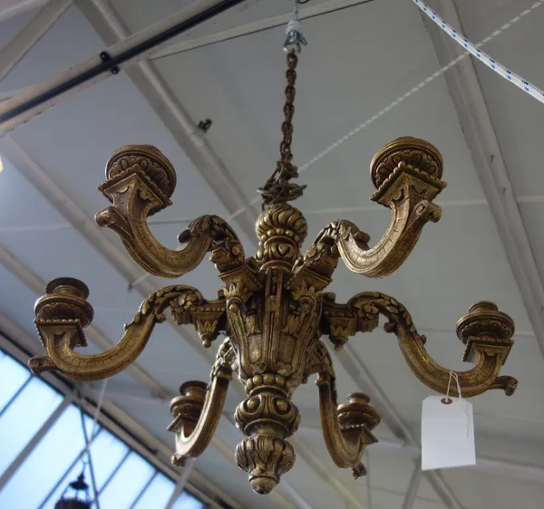 A Georgian style gilt wood chandelier, modern, the carved baluster stem with flambé finial issuing six swan neck arms with carved circular sconces, su
