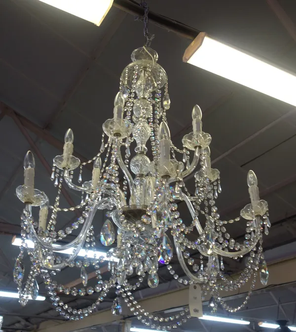 A pair of modern moulded glass twelve light chandeliers, late 20th century, the baluster stem issuing twelve glass branches arranged over two graduate