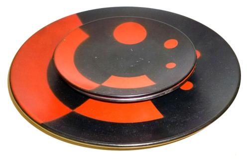 A Suprematist dinner plate and two matching side plates, the design attributed to El Lissitzky, Russia, 1920s or later, all impressed '2864', the larg