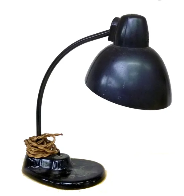 After Marianne Brandt; a type 034.4 desk lamp, on a black stepped slipper base, 36cm high; a pair of brass and grey painted metal table lamps; and an
