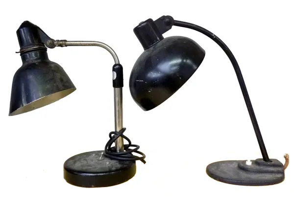 An unmarked black desk lap, probably German, 1930-1940, 37.5cm high; another adjustable desk lamp, 39cm high; three assorted machinist lamps and three