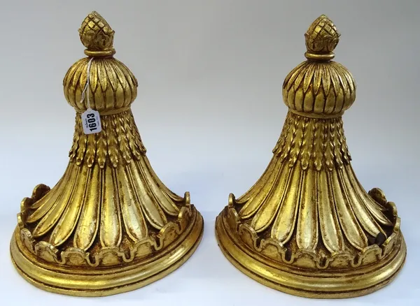 A pair of Regency style gilt plaster wall brackets, with pineapple finials, 30cm wide x 34cm high, (2).