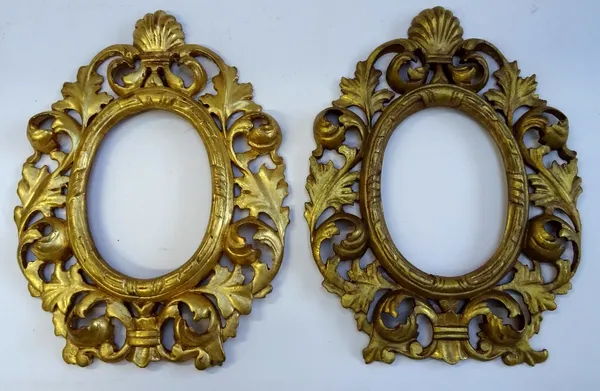 A pair of 18th century style acanthus carved gilt frames, each with oval aperture and shell crest, 22cm wide x 30cm high, (2).