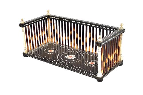 A 19th century Anglo-Indian ivory and porcupine quill book stand, with floral and dot work decoration, 34cm wide x 15cm high x 16cm deep.  Illustrated