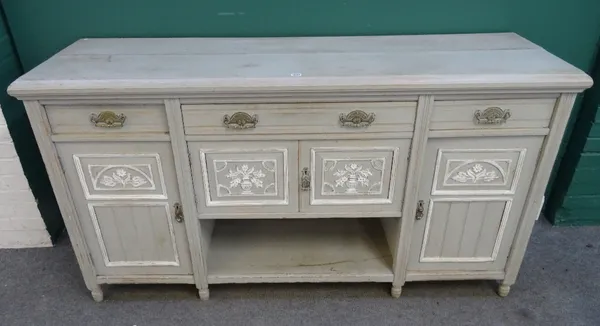 A late 19th century, later grey painted sideboard, with three drawers over four cupboards on turned supports, 183cm wide x 98cm high x 57cm deep.