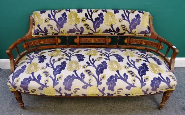 An Edwardian marquetry inlaid rosewood tub back sofa, with bow seat on spiral supports, 148cm wide x 77cm high.