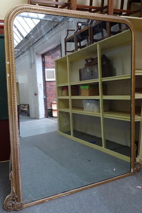 A 19th century large gilt framed arch top overmantel wall mirror, with moulded frame, 189cm wide x 214cm high. Please note that this lot is subject to