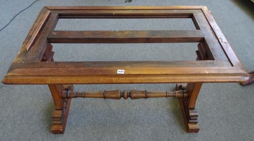 An early Victorian mahogany centre table base, with rounded rectangular top on pair of trestle end standards, united by carved stretcher, 112cm wide x