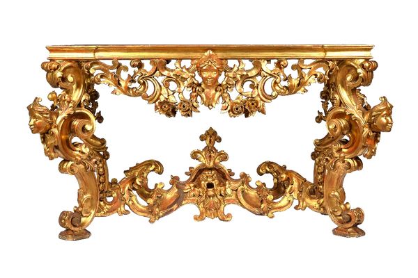 A 19th century carved giltwood console table base of 18th century design, the rectangular top lacking marble, over a carved and pierced foliate base o