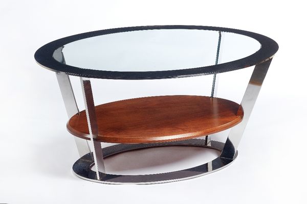 Linley, 20th century; an oval coffee table, the polished steel halo rim with inset glass panel, united by walnut platform undertier, 100cm wide x 48cm
