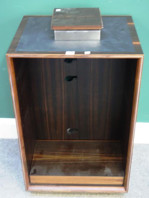 Linley, 20th century; a macassar audio-visual unit, with leather inset rectangular top above an open shelf, on polished steel plinth, 52cm wide x 80cm