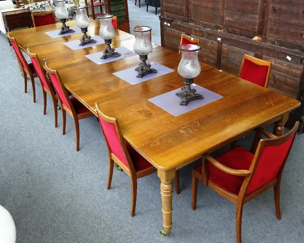 'Russell G. Walker, Cabinet Maker, Nunthorpe, North Yorkshire', a 20th century oak extending dining table, the rounded rectangular top on eight turned