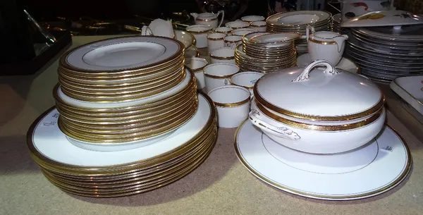 A large Coalport part dinner service, decorated in cream with a gilt border, in the Elite pattern, (qty).  S2