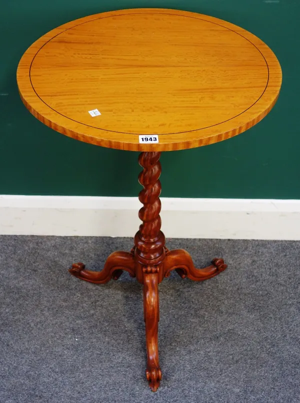 A Victorian satinwood circular tripod table, on barleytwist column and three downswept supports, 51cm wide x 73cm high.