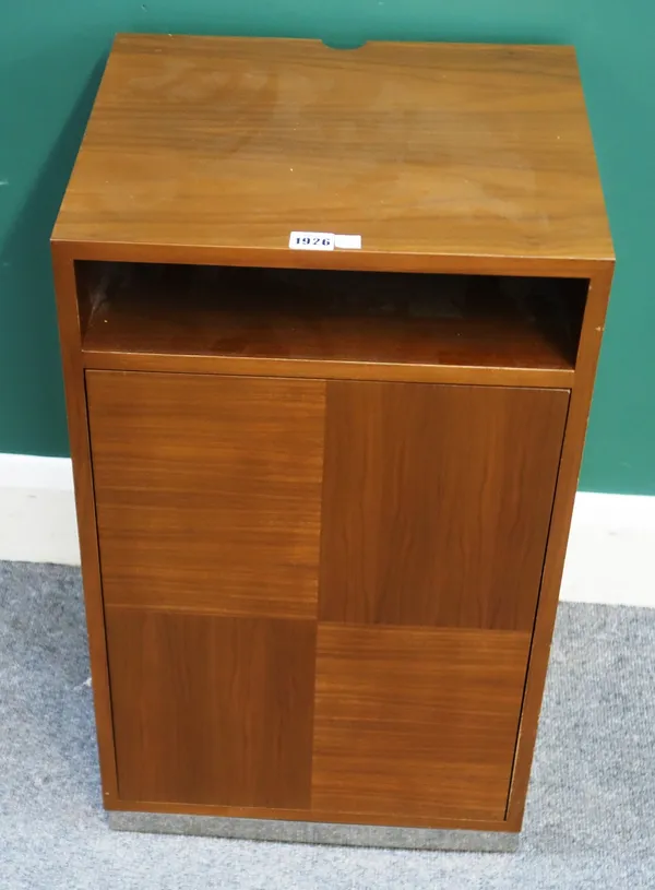 Linley, 20th century; a walnut side cabinet, with recess over push-operated single door, on polished steel plinth, 40cm wide x 66cm high x 36cm deep.