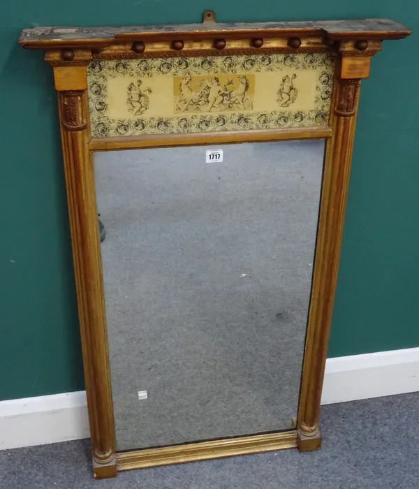 A 19th century gilt framed pier glass, the inverted ball mounted crest, over a cherub decorated faux ivory panel and rectangular mirror plate, 63cm wi