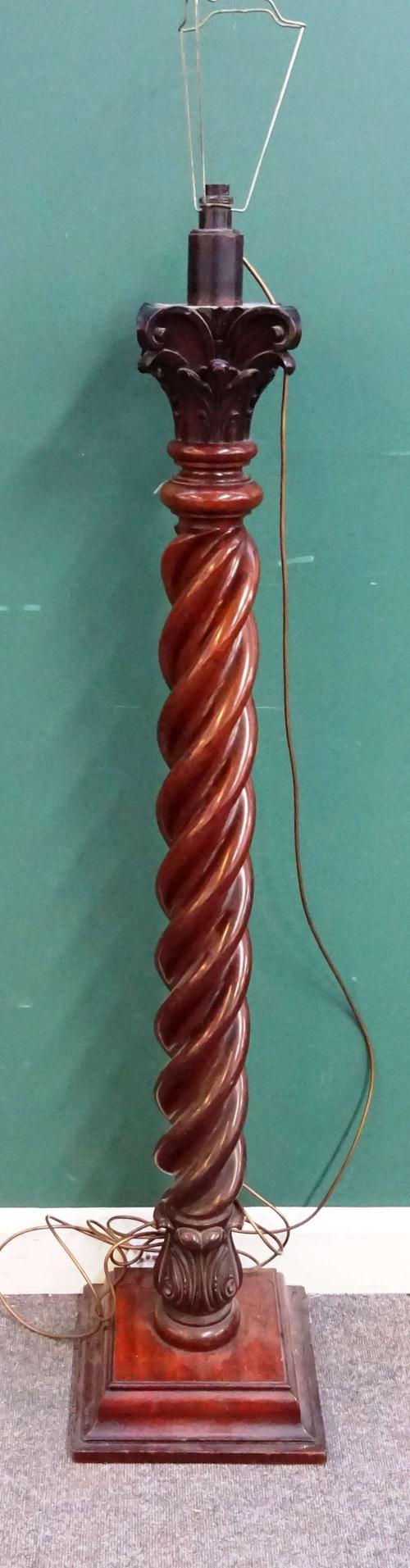 A mahogany standard lamp, William IV and later, with Corinthian column capital, over heavy barley-twist column on stepped square base, 140cm high excl