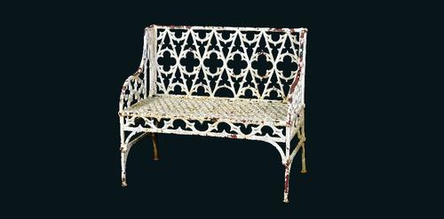 After Val d'Osne, a matched pair of 19th century white painted cast iron Gothic revival garden benches, each 100cm wide x 92cm high, (2).  Illustrated