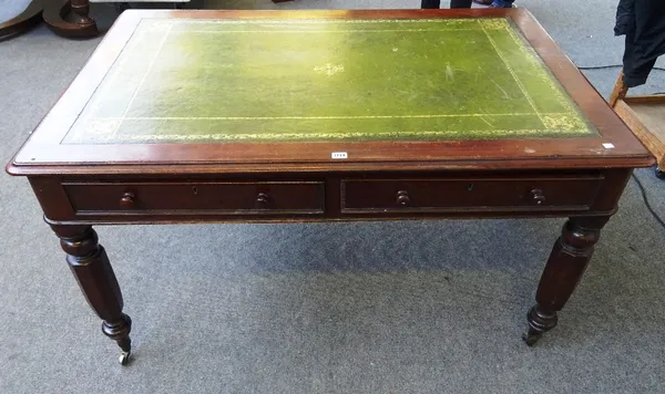A Victorian mahogany centre writing table, with two pairs opposing frieze drawers on tapering octagonal supports, 137cm wide x 74cm high x 93cm deep.