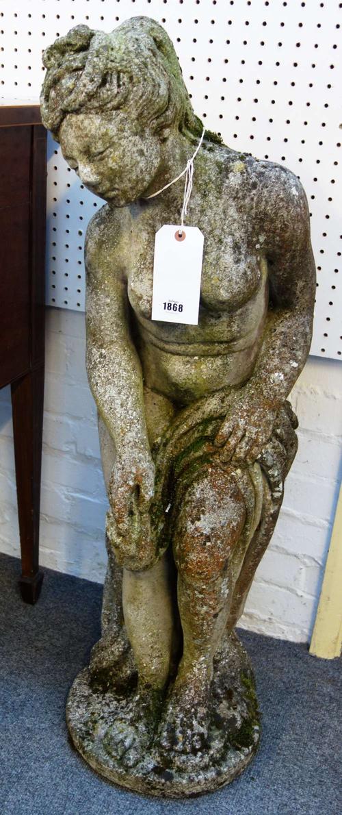 After Etienne Maurice Falconet; a reconstituted stone figure group of the bathing Venus, 30cm wide x 106cm high.