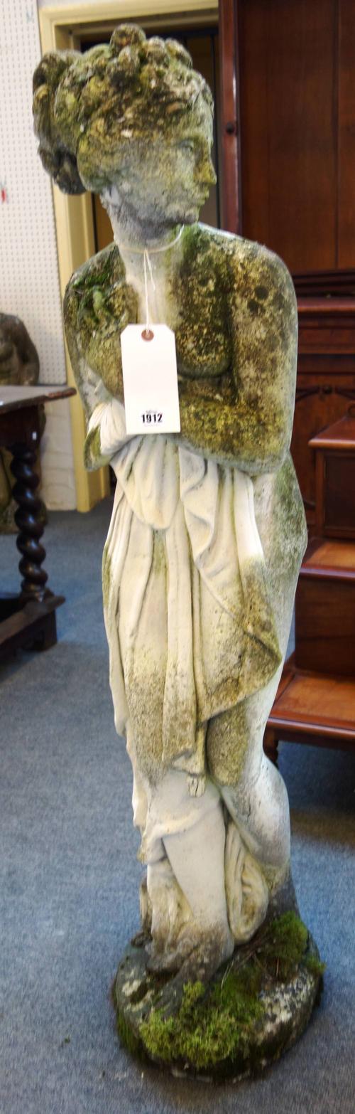 After Canova, a reconstituted stone figure of Venus, on a shaped circular base, 33cm wide x 129cm high.