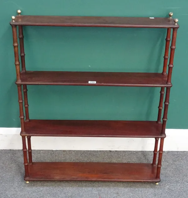 A set of 19th century mahogany hanging four tier open shelves on turned supports, 68cm wide x 81cm high x 15cm deep.
