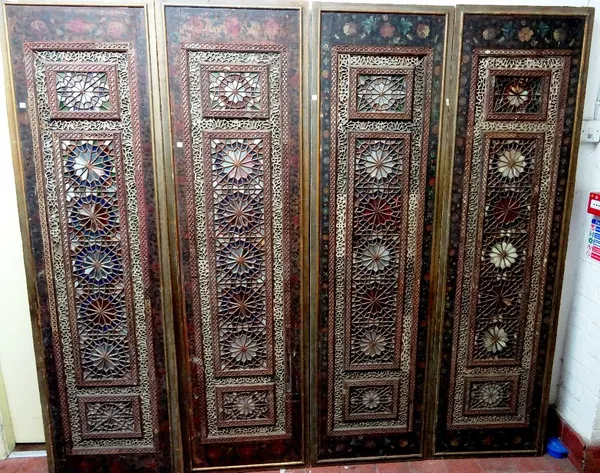 A set of four Qajar panels, each with floral painted decoration and inset glass mosaic, each panel 54cm wide x 189cm high.