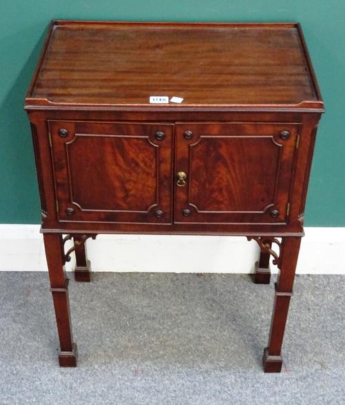 A George III mahogany tray top bedside table, with pair of doors on square supports, 52cm wide x 70cm high x 34cm deep.
