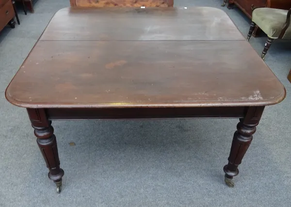 A William IV mahogany extending dining table, on lappet carved supports, lacking extra leaves, 130cm wide x 130cm long x 73cm high.