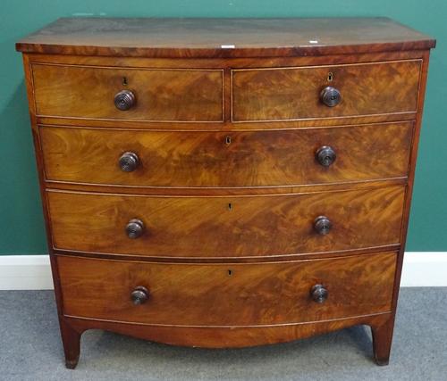 An early Victorian mahogany bowfront chest of two short and three long graduated drawers, on bracket feet, 106cm wide x 103cm high x 53cm deep.