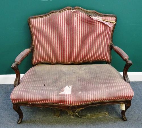 An 18th century French stained beech open arm sofa, with serpentine seat on scroll supports, 112cm wide x 100cm high.