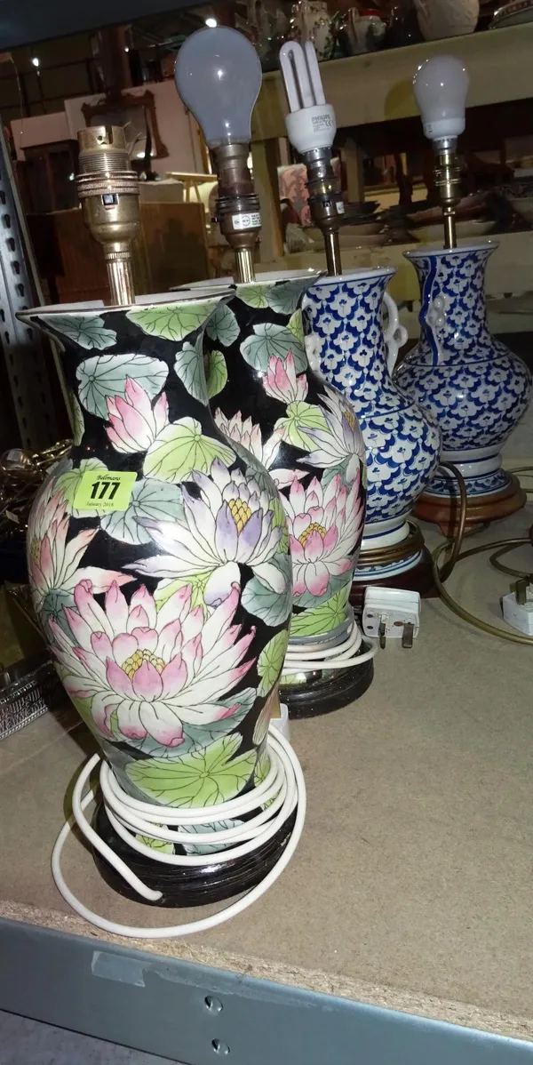 A pair of Chinese style floral decorated table lamps and a pair of blue and white table lamps, (4).   S2
