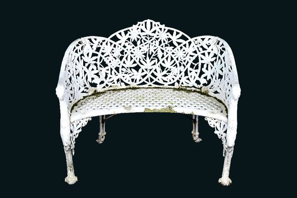 After Coalbrookdale, a white painted cast aluminium passion flower pattern concave garden bench, taken from a design in the 1875 catalogue, number 32,