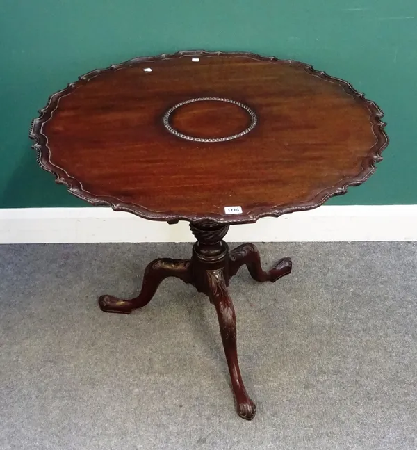 A George III mahogany occasional table, the pie-crust snap top on birdcage mount and carved tripod base, 84cm diameter x 71cm high.