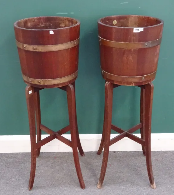 R. A. LISTER & CO. LTD. DURSLEY ENGLAND; a pair of 20th century coopered mahogany jardinieres on stands, 38cm wide x 104cm high.
