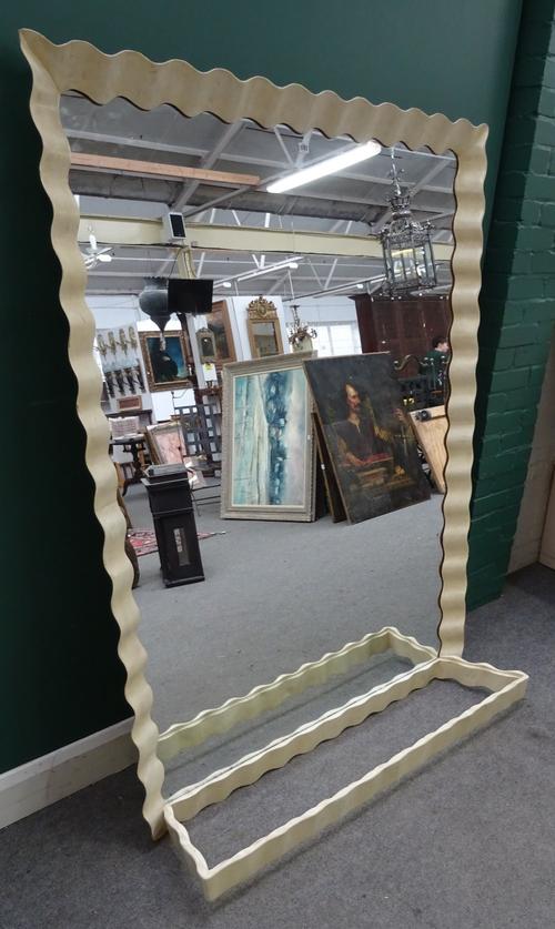 A mid 20th century console table and mirror with undulating wriggle work vellum veneered frame, 134cm wide x 170cm high x 30cm deep.