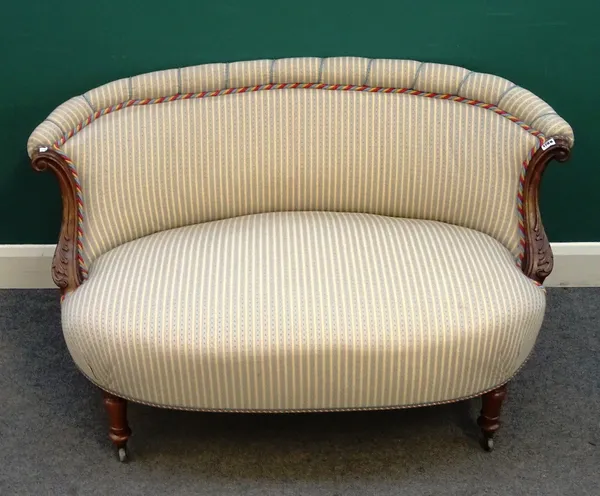 A 19th century two seat small shaped sofa, with acanthus carved scrolling arms and bow seat, on turned supports, 125cm wide x 71cm high.
