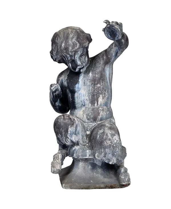 A lead figure cast as a seated fawn, on a flared square base, 28cm wide x 60cm high.  Illustrated