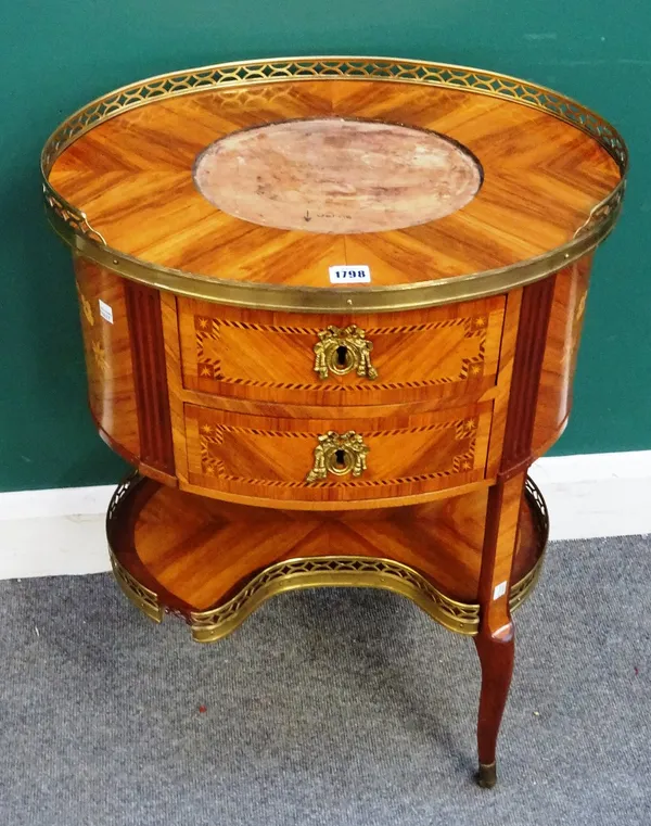 A late 18th century/early 19th century French gilt metal, porcelain mounted and inlaid kingwood two drawer side table with platform undertier, 50cm wi
