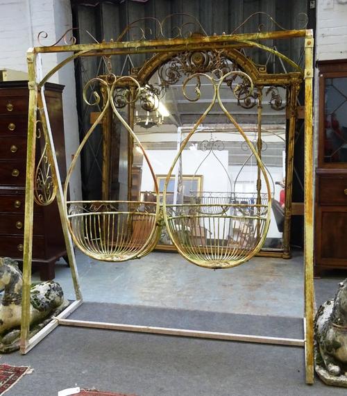 A 20th century white painted metal garden lovers swing bench, with pair of onion shape seats, on 'A' frame supports, 19cm wide x 222cm high.