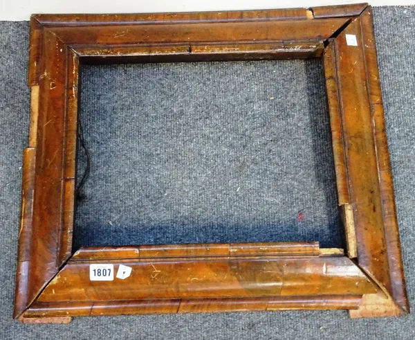 A William and Mary walnut cushion frame wall mirror frame, (a.f), 47cm x 56cm.