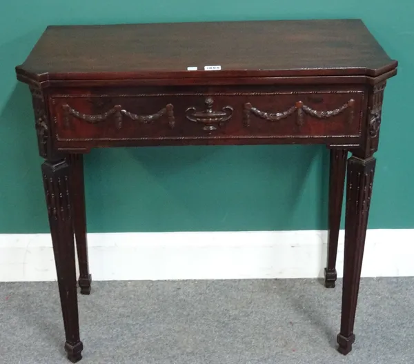 An 18th century Dutch mahogany tea table, the dished fold out top over fitted recess and side drawer, on tapering square supports, 77cm wide x 75cm hi