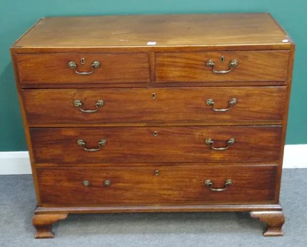 A George III mahogany chest of two short and three long graduated drawers, on ogee bracket feet, 112cm wide x 93cm high x 53cm deep.  6