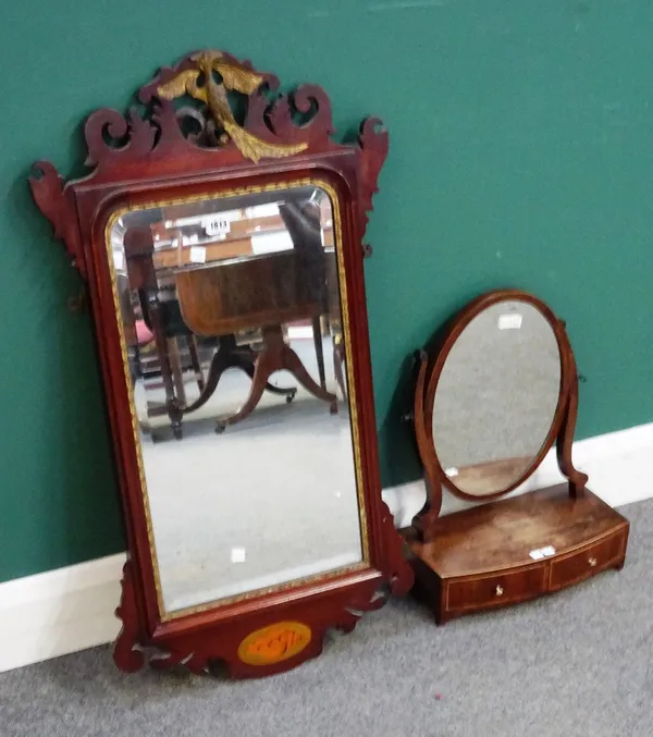 An early 19th century parcel gilt inlaid mahogany fret cut pier glass, 49cm wide x 91cm high, together with a Regency mahogany small toilet mirror wit