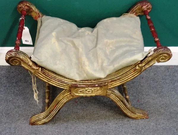An Egyptian Revival parcel gilt X frame stool, with turned supports, 77cm wide x 47cm deep x 51cm high.