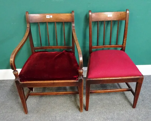 A pair of late George III mahogany open armchairs on tapering square supports, together with a matching single chair, (3).  12
