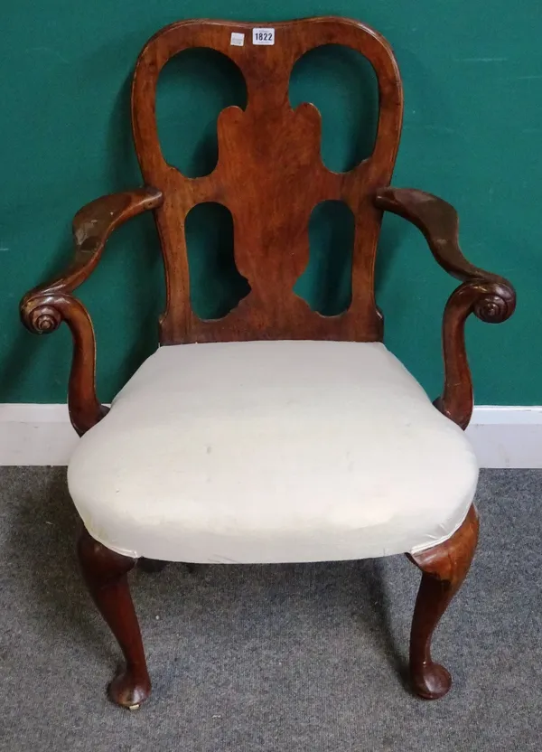 A George I walnut open armchair, with shaped vase back, on club supports, 67cm wide x 90cm high.