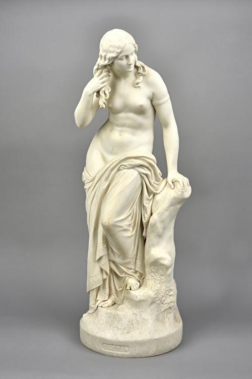 A Copeland parian figure of 'Egeria' by J.H Foley R.A, mid-19th century, semi nude female figure aside a tree stump atop a naturalistic circular base,
